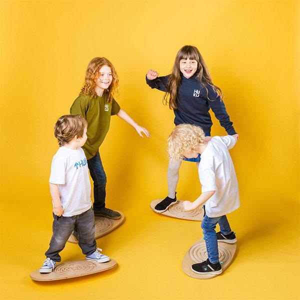 Kids playing on a wobble board